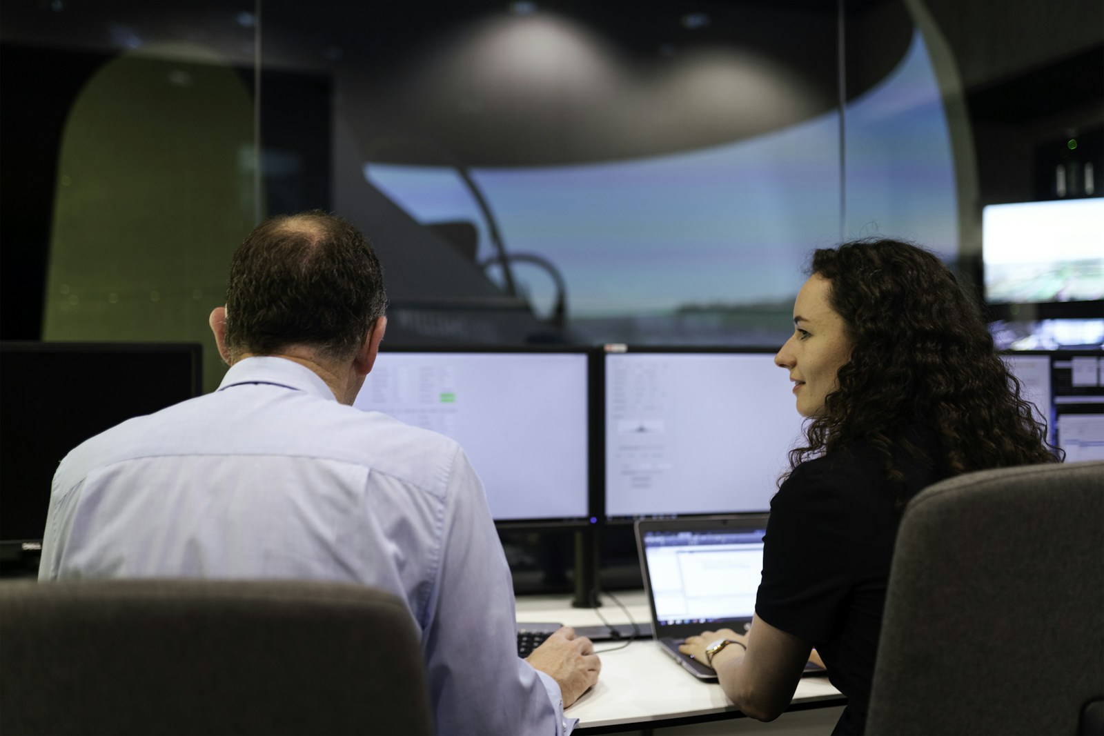 NOC strategy session: technical advisor and engineer reviewing infrastructure