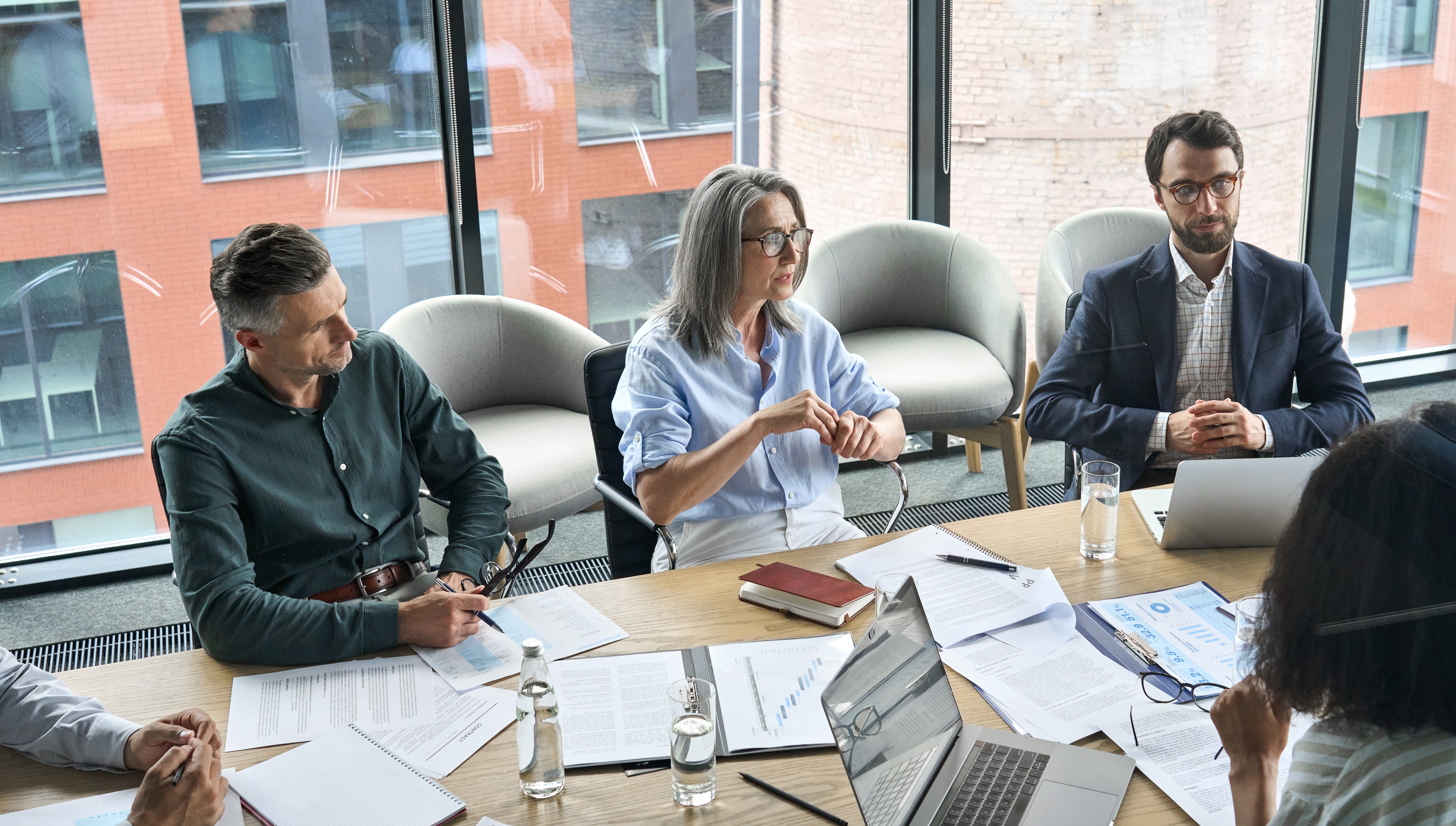 A senior advisor leading an executive team through a strategic security planning session